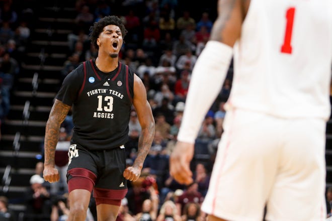 Texas A&M's Solomon Washington (13) reacts after his team scored during the second round game between Texas A&M and the University of Houston in the 2024 NCAA Tournament at FedExForum in Memphis, Tenn., on Sunday, March 24, 2024.