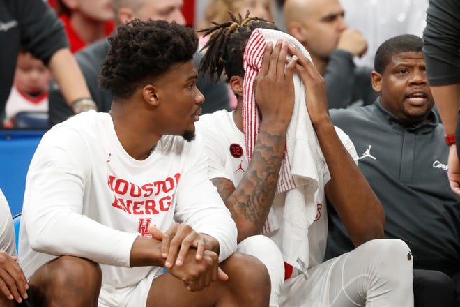 Houston's Ja'Vier Francis (5) puts his head in his hands on the bench after fouling out during the second round game between Texas A&M and the University of Houston in the 2024 NCAA Tournament at FedExForum in Memphis, Tenn., on Sunday, March 24, 2024.
