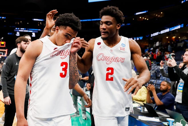 Houston's Ramon Walker Jr. (3) and Cedric Lath (2) walk off the court as Walker Jr. becomes emotional after Houston defeated Texas A&M 100-95 in overtime in the second round of the 2024 NCAA Tournament at FedExForum in Memphis, Tenn., on Sunday, March 24, 2024.