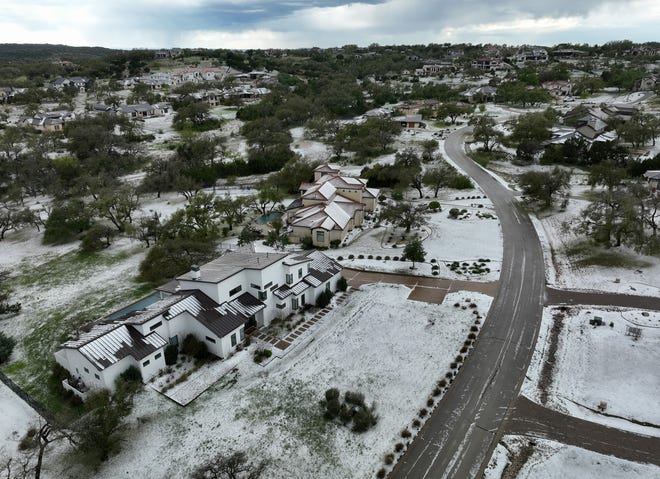 Hail covers the ground in the Belvedere neighborhood on Hamilton Pool Road near Bee Cave Wednesday March 27, 2024.