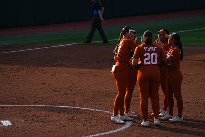 The Texas Longhorns huddle on the field at the start of the bottom of the second inning during the game against Iowa State at Red and Charline McCombs Field on Friday, April 26, 2024 in Austin.
