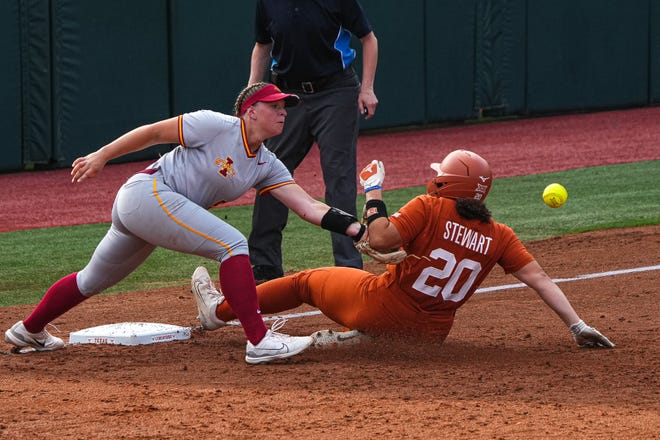 Texas Longhorns infielder Katie Stewart (20) slides to third past Iowa State infielder Ashley Minor (50) during the game at Red and Charline McCombs Field on Friday, April 26, 2024 in Austin.