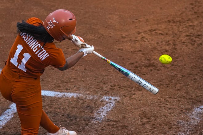 Texas Longhorns infielder Alyssa Washington (11) hits the ball during the game against Iowa State at Red and Charline McCombs Field on Friday, April 26, 2024 in Austin.